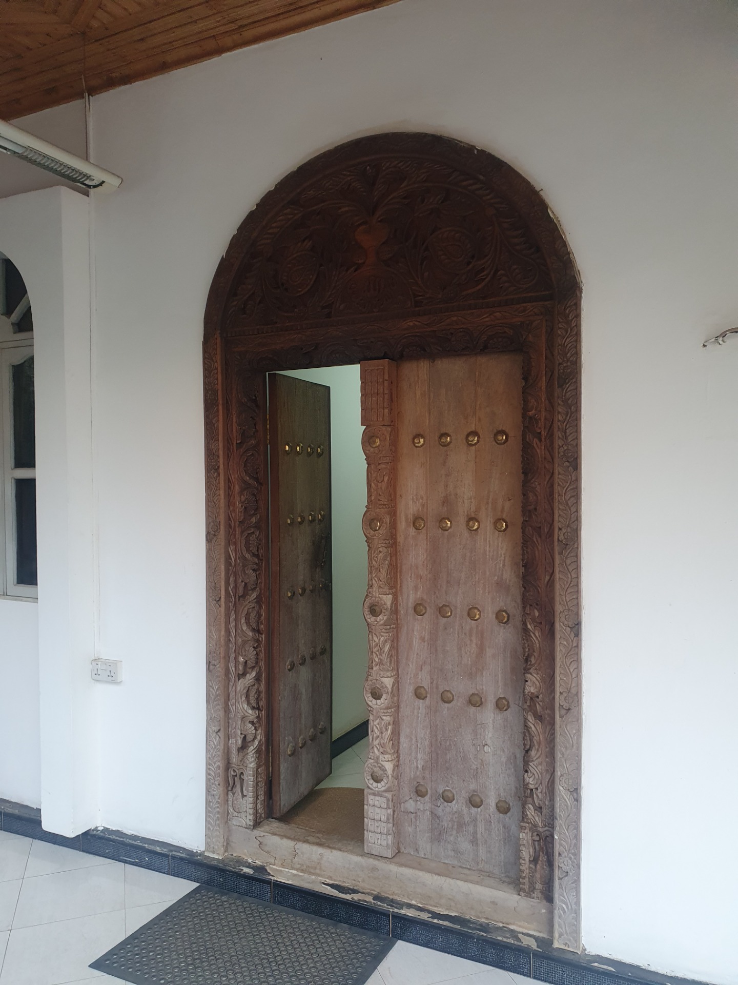 The carved wooden entrance to ZanAid Clinic