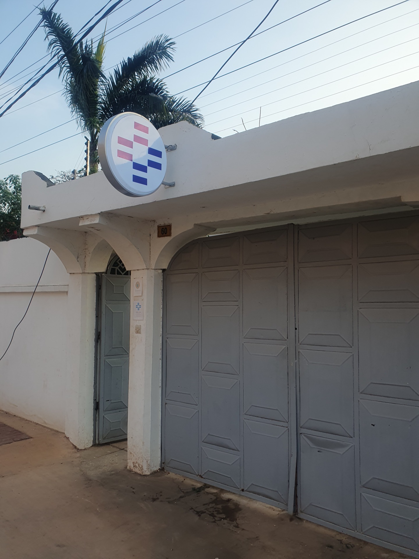 ZanAid Clinic exterior, sign and number 60